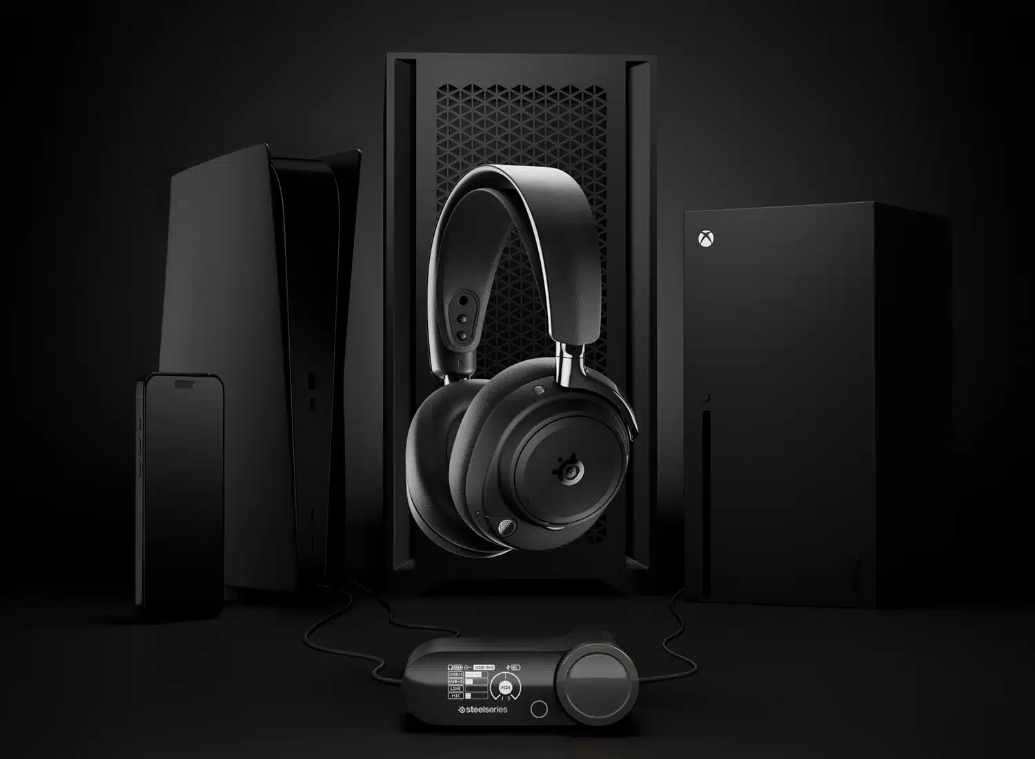 A pair of black SteelSeries Arctis Nova Elite over-ear headphones with an attached control unit is displayed in front of a PlayStation 5, an Xbox Series X, and a smartphone, all set against a dark background.