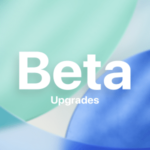 White text reads "Beta Upgrades" over a soft, abstract background of overlapping green, blue, and cream shapes with a blurred, gradient effect—perfect for discussing iOS beta 26 or the differences between public beta vs developer beta.