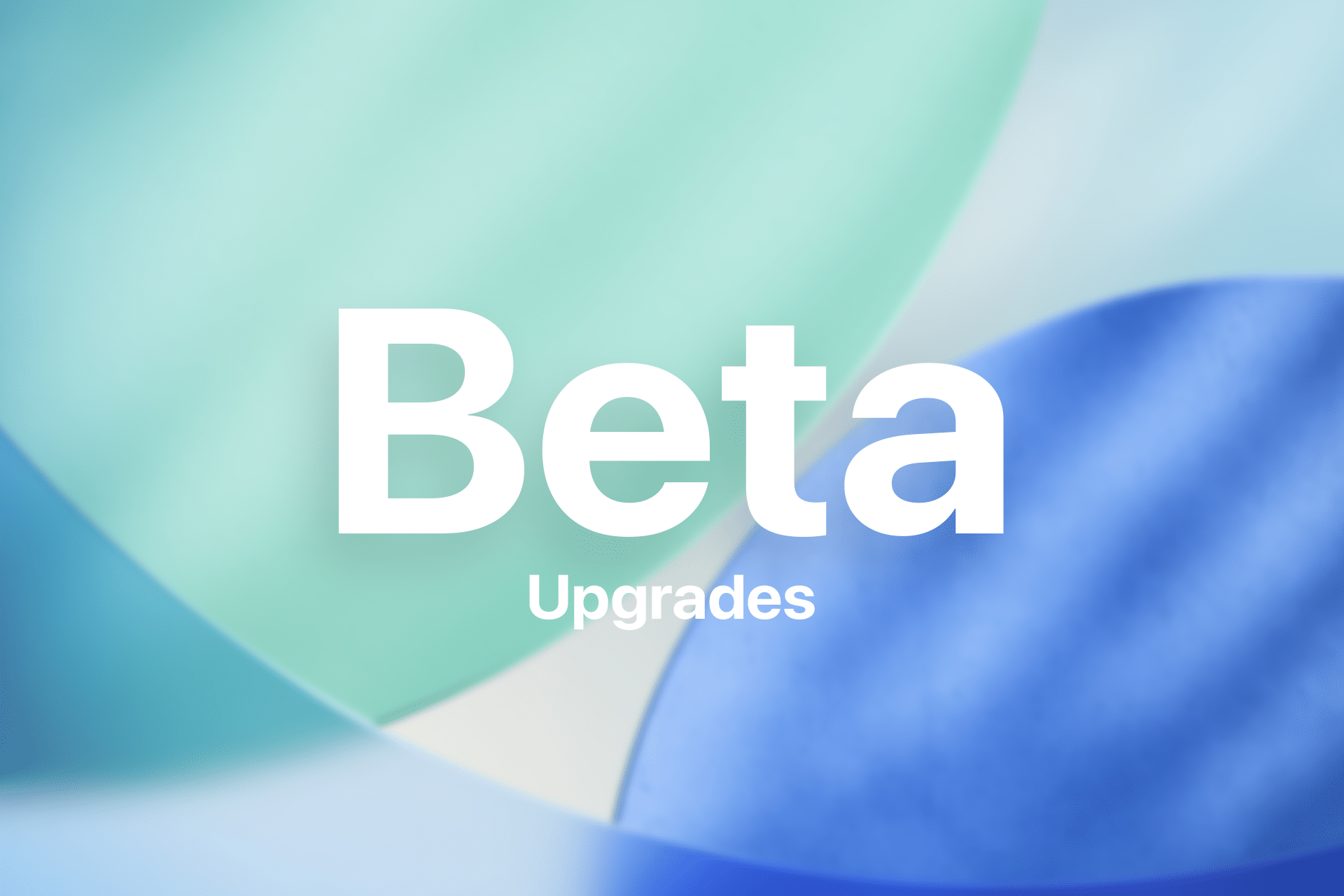 White text reads "Beta Upgrades" over a soft, abstract background of overlapping green, blue, and cream shapes with a blurred, gradient effect—perfect for discussing iOS beta 26 or the differences between public beta vs developer beta.