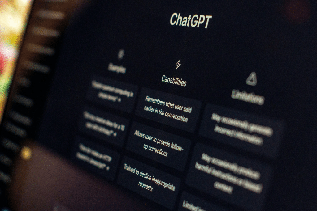 A computer screen displays the ChatGPT interface, highlighting the "Capabilities" section with text on features like remembering conversation and allowing follow-ups. OpenAI parental safety controls ChatGPT ensure secure and responsible use; examples and limitations are partially visible.