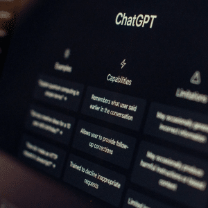 A computer screen displays the ChatGPT interface, highlighting the "Capabilities" section with text on features like remembering conversation and allowing follow-ups. OpenAI parental safety controls ChatGPT ensure secure and responsible use; examples and limitations are partially visible.