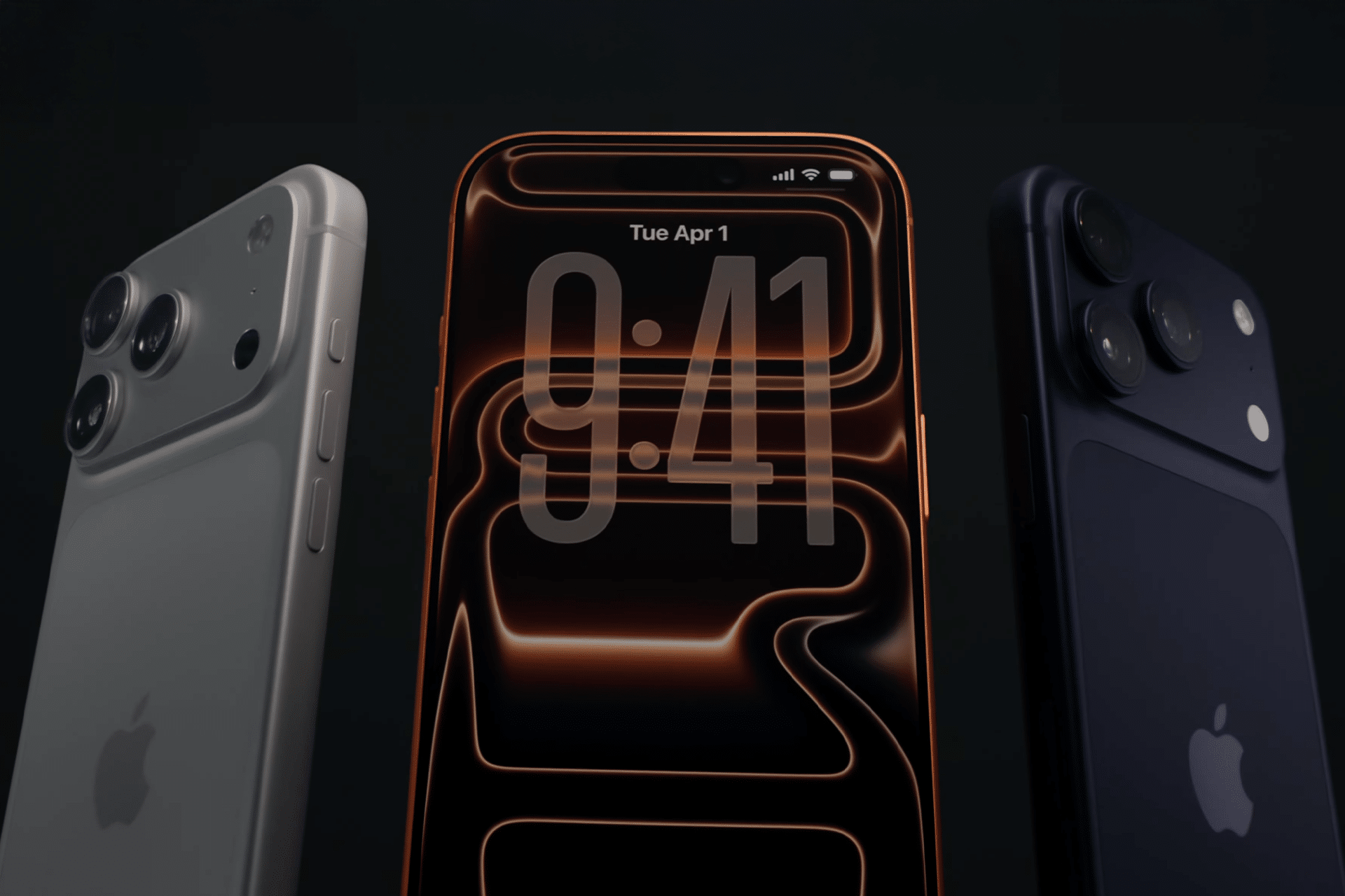 Three iPhones are displayed: one silver and one black showing their backs with triple camera lenses, and a center phone—possibly the iPhone 17 Pro Max—showing its screen with the time 9:41, Tuesday, April 1 on a dark abstract background.