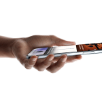 A hand holds a Super-Thin iPhone Air horizontally, displaying a digital wallet app with a credit card and event ticket visible on the sleek metallic-edged screen.