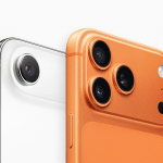 Close-up of the rear cameras on two smartphones—one white with a single lens, the other orange with three lenses and a flash—highlighting Apple moving luxury away from the Pro line in this Air vs Pro comparison.