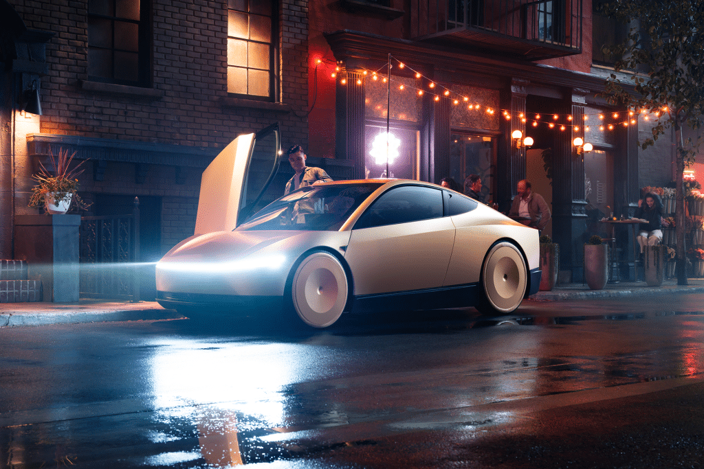 A sleek, futuristic white car—reminiscent of Elon Musk robotaxi production—with gullwing doors open is parked on a wet city street at night, its headlights and string lights glowing as people relax at a nearby sidewalk cafe.