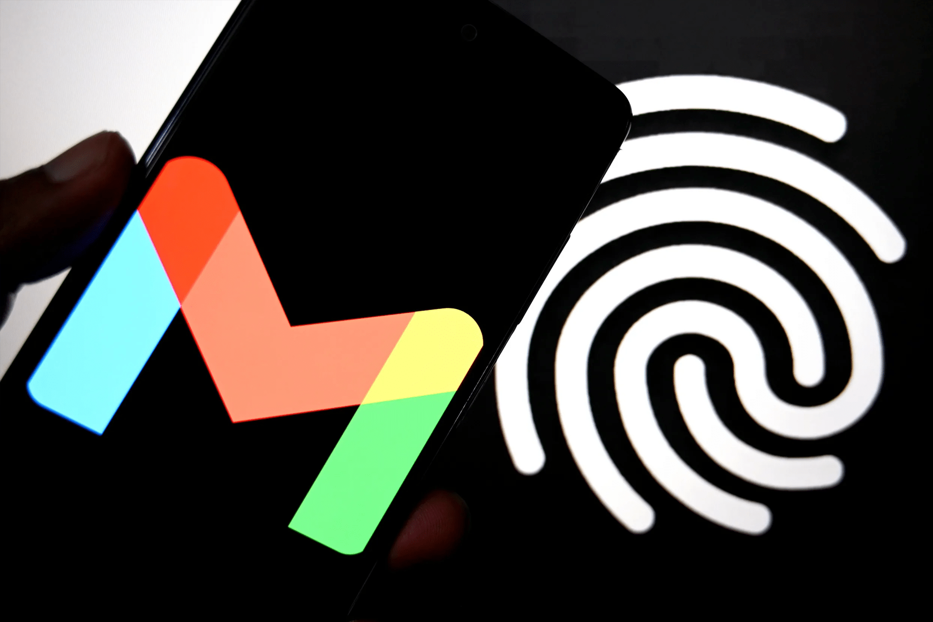A smartphone displays the Gmail app logo in front of a large, illuminated fingerprint icon, hinting at digital security or authentication in the wake of recent Gmail data breach concerns.