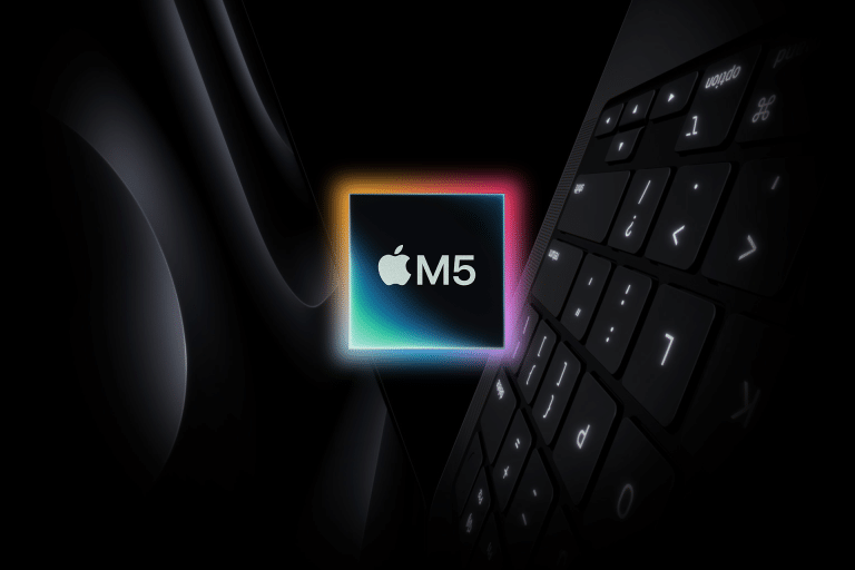 A glowing Apple M5 chip logo appears at the center, surrounded by dark shadows, hinting at impressive M5 chip performance, with part of a MacBook keyboard and a sleek Apple device visible in the background.