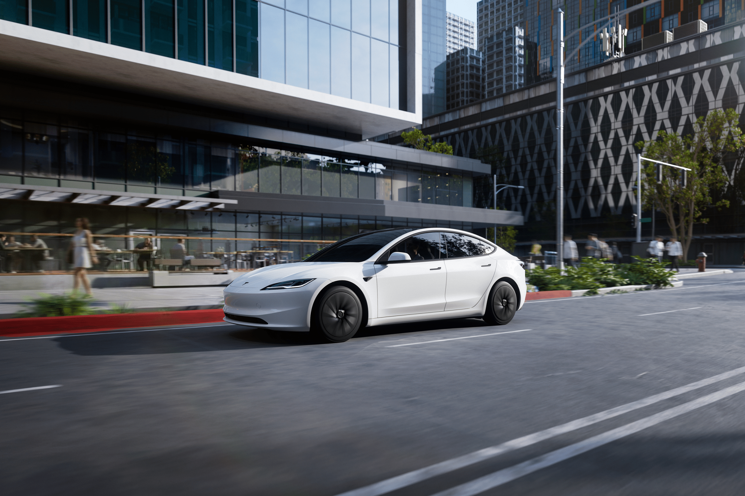 A sleek white 2026 Tesla Model 3 electric sedan glides down a city street lined with modern glass buildings, greenery, and outdoor seating on a sunny day.
