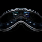Close-up view of the inside of the Apple Vision Pro headset, showing multiple cameras, sensors, and visible Apple M2, R1, and Vision Pro M5 chips—all set against a black background.