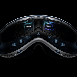 Close-up view of the inside of the Apple Vision Pro headset, showing multiple cameras, sensors, and visible Apple M2, R1, and Vision Pro M5 chips—all set against a black background.