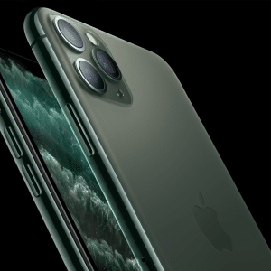 Two green iPhone 11 Pro Max smartphones are shown, both with black screens featuring a dark wave pattern. One phone displays the vintage-inspired back with three camera lenses, while the other reveals the side and screen against a solid black background.