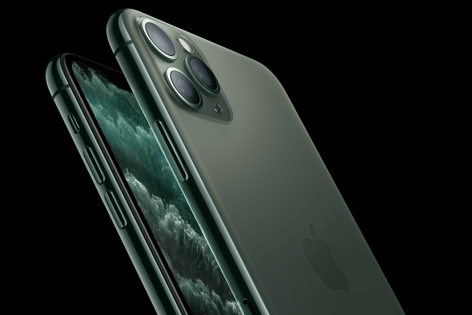 Two green iPhone 11 Pro Max smartphones are shown, both with black screens featuring a dark wave pattern. One phone displays the vintage-inspired back with three camera lenses, while the other reveals the side and screen against a solid black background.