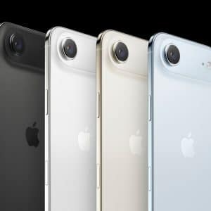 Four Apple iPhones in black, white, gold, and blue stand upright in a row, showcasing their rear sides and single rear cameras against a black background—perfect for an iPhone 17 Air display test.