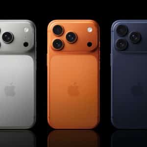 Three Apple iPhones are shown from the back in silver, orange, and dark blue, each featuring three camera lenses and the Apple logo—an ideal lineup for Belgian consumers interested in Lyca Mobile eSIM or new iPhone contracts.