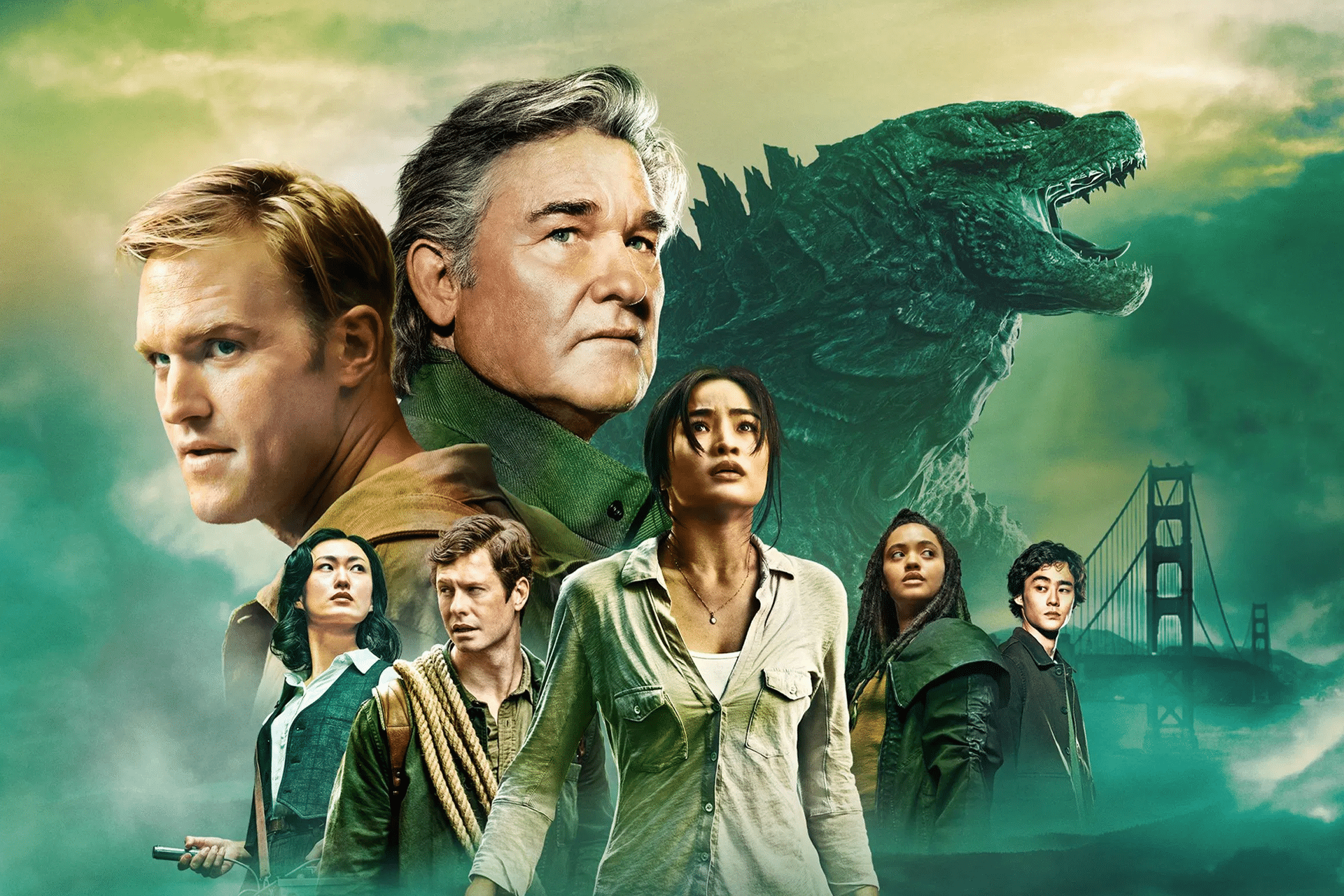 A dramatic scene with seven serious-looking people standing before a large Godzilla creature, the Golden Gate Bridge, and a green, smoky sky in the background—setting the stage for Monarch Legacy of Monsters Season 2.