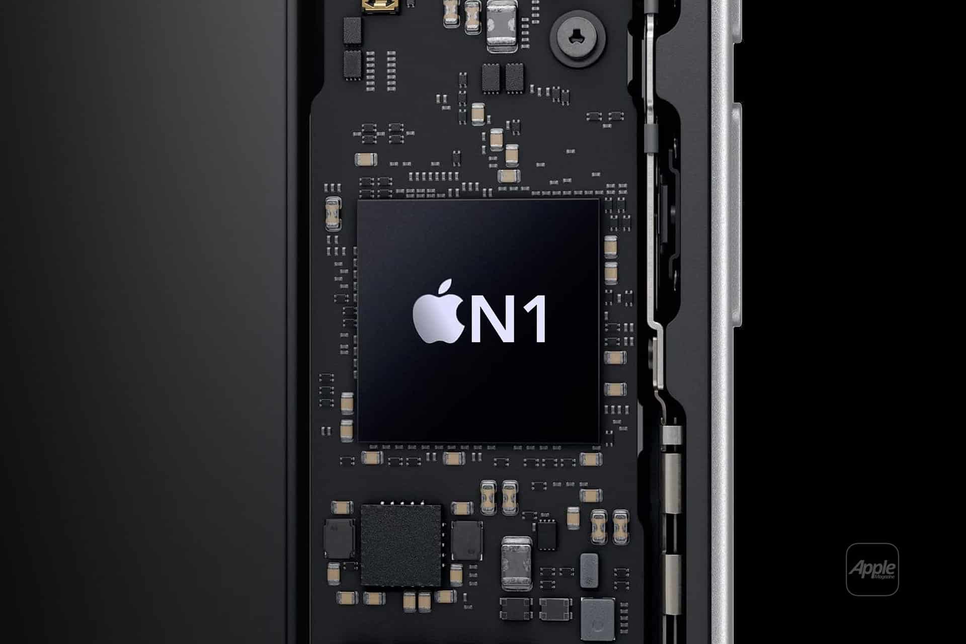 Close-up of a circuit board inside an electronic device, featuring a large black chip labeled with the Apple logo and "N1" in white text—identifying it as the Apple N1 wireless processor. Various electronic components surround the central chip.
