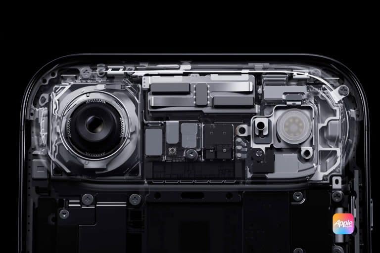 A close-up, cross-section view of a smartphone’s internal components—highlighting a large camera lens, circuitry, and chips—showcases the Apple logo in the bottom right corner and hints at advanced Apple 3D printing technology.