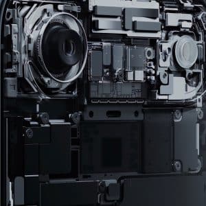 Close-up view of the internal components of a smartphone, showing detailed circuitry, camera modules, and microchips. The Apple logo appears in the lower right corner, highlighting innovative Apple 3D printing technology in device assembly.