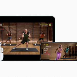 Apple AirPods, iPad, iPhone, and Apple Watch display workout sessions and fitness stats with Apple Fitness+, showing people exercising indoors using digital fitness tracking on each device.