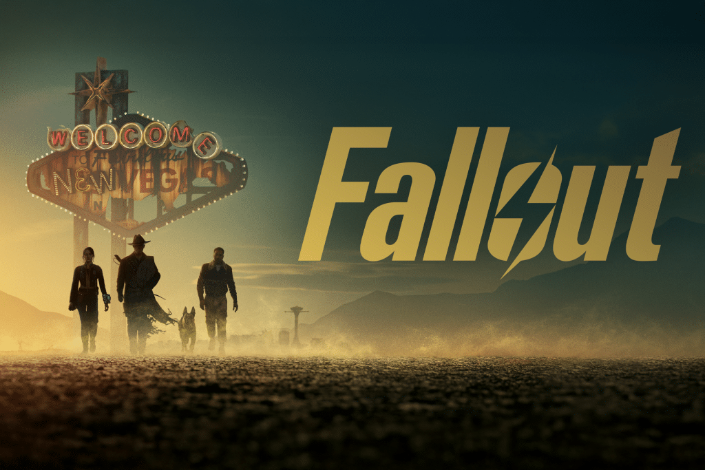 Four people and a dog walk on a dusty road at sunset beneath a damaged “Welcome to New Vegas” sign, with mountains in the background. Large yellow text reads “Fallout.” Get ready for Fallout Season 2, coming soon to Prime Video.