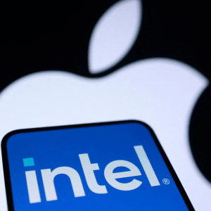 A smartphone screen displays the blue Intel logo, hinting at an Apple Intel chip partnership, with a large, white, blurred Apple logo in the background.