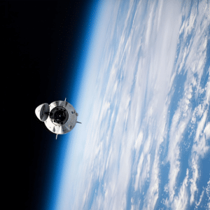 A SpaceX spacecraft orbits above Earth, with the planet’s blue atmosphere and white clouds visible below and the darkness of space in the background—hinting at possibilities like a potential SpaceX 2026 IPO.
