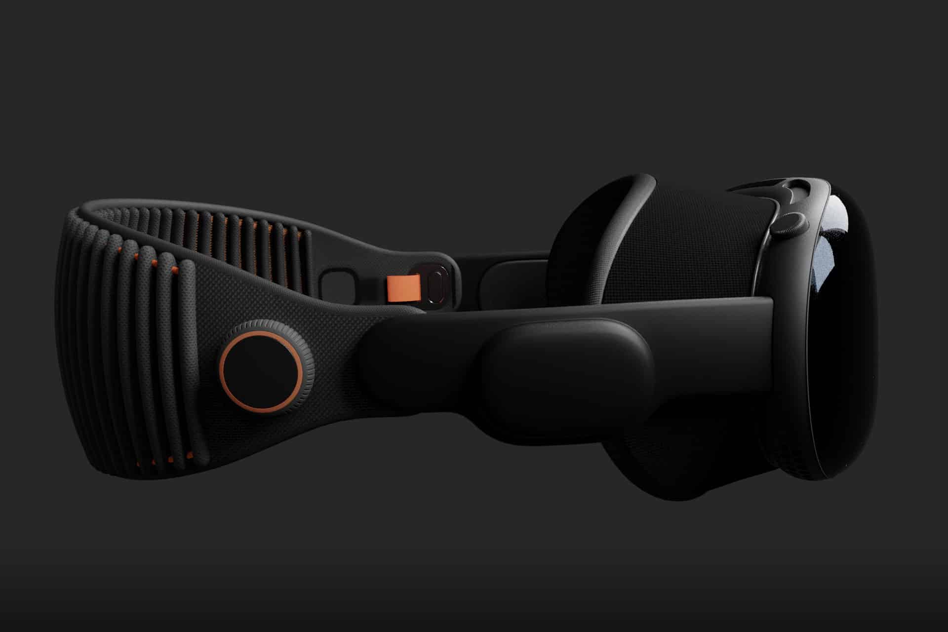 An all-black virtual reality headset with a ribbed, adjustable strap, orange accents, and a large, glossy visor is displayed against a dark background, reminiscent of early Vision Pro prototype parts.