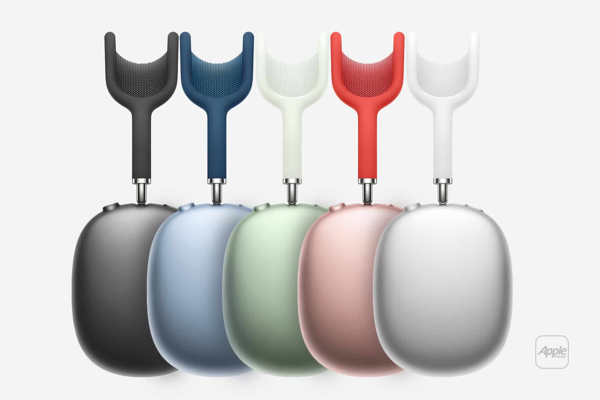 Five AirPods Max headphones in black, blue, green, pink, and silver are displayed upright in a row on a white background with the Apple logo in the lower right corner.