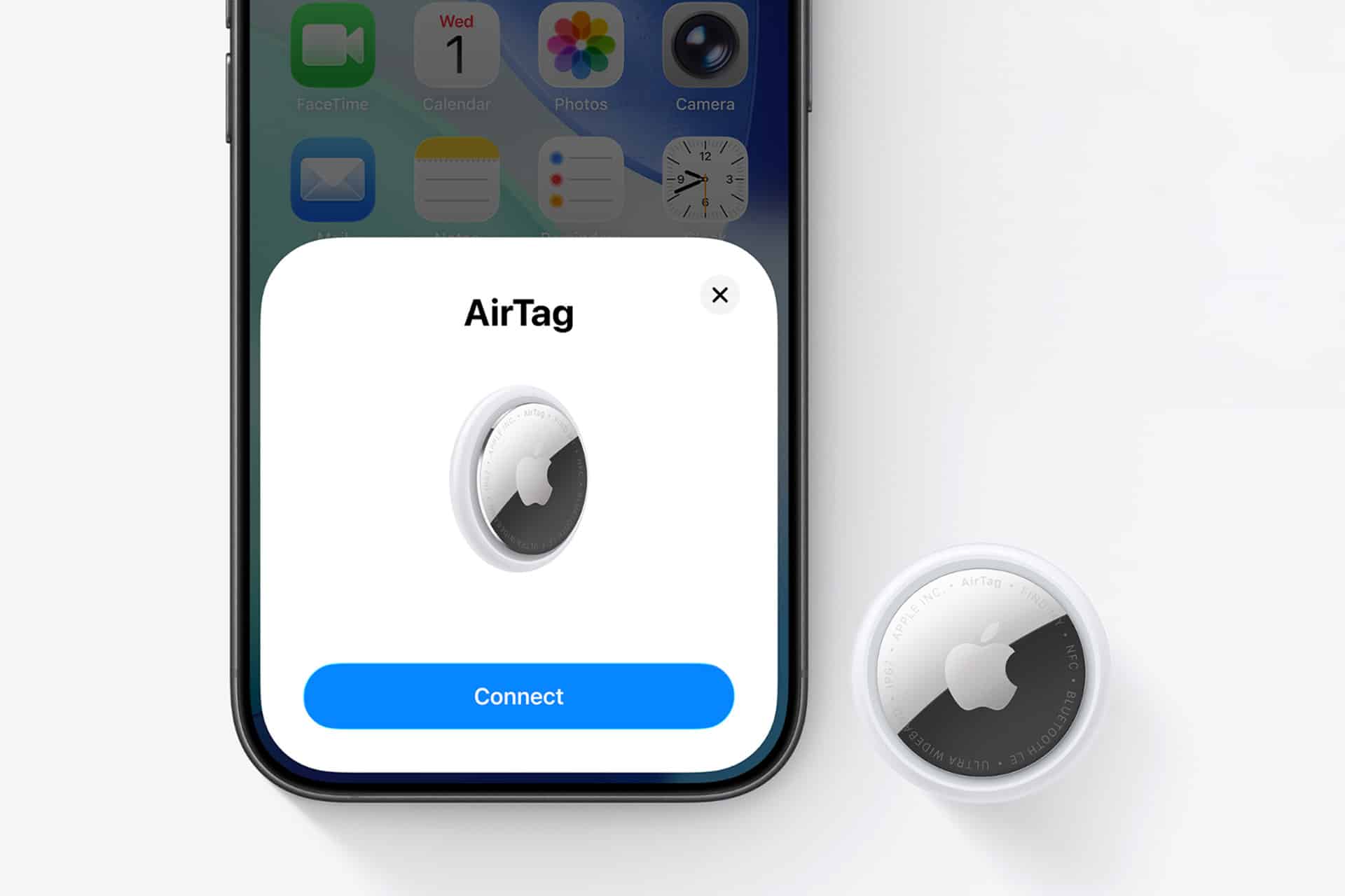 A smartphone displays a New AirTag setup screen with a "Connect" button. An Apple AirTag device is positioned on a white surface next to the phone.
