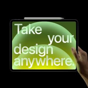 A hand holds a tablet with a stylus on top. The screen displays the text “Take your design anywhere.” in large white letters over a green and yellow gradient, showcasing Apple Creator Studio’s creative flexibility.