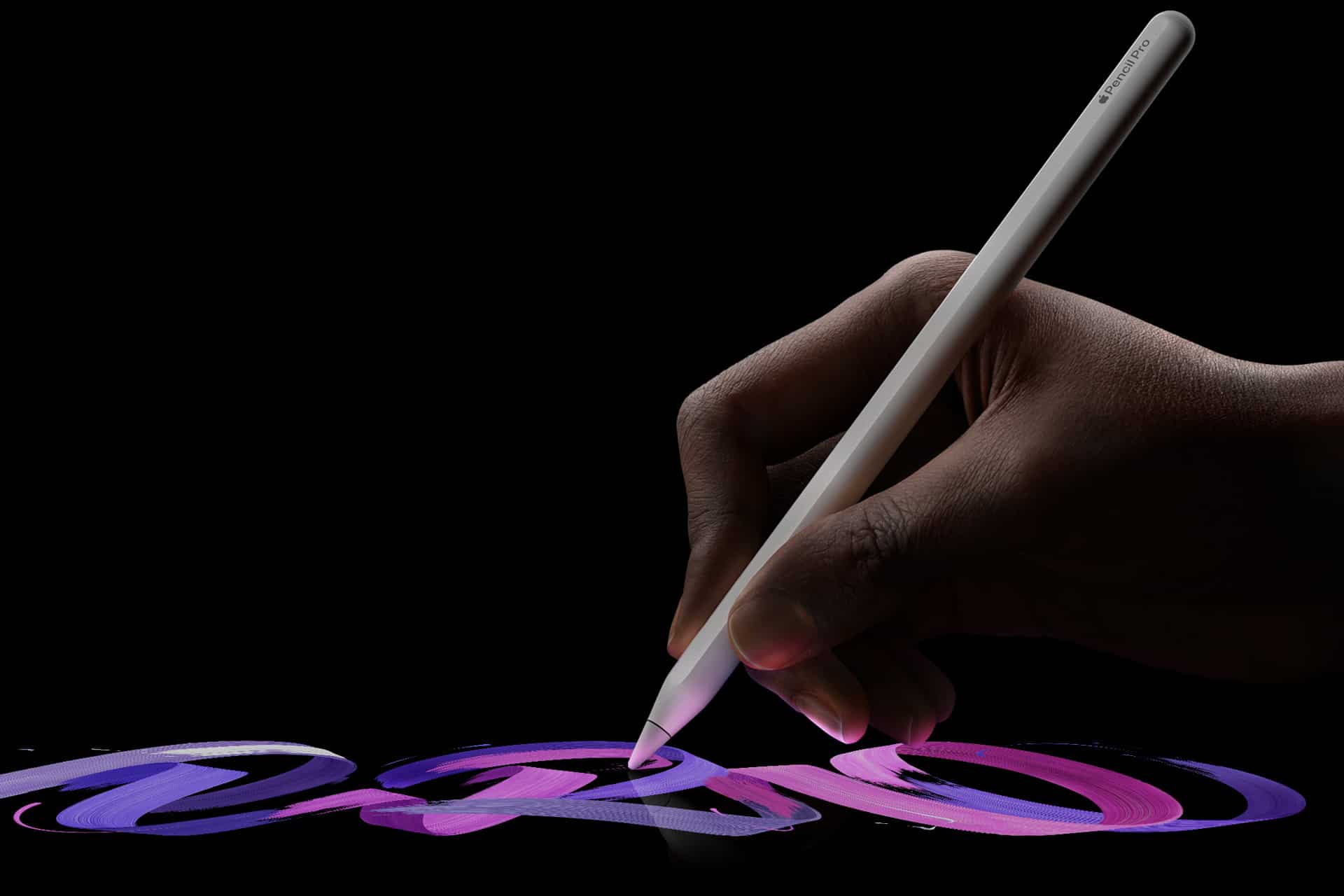 iPad Handwriting Search - A hand holding an Apple Pencil Pro draws swirling strokes of purple and pink on a black iPad screen, the stylus tip glowing where it touches—capturing creative energy in the spirit of Apple Creative Studio.