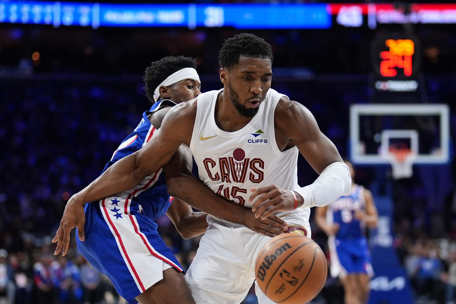 A basketball player in uniform with a ball in his hand, ready for the action of Apple TV Game Night.