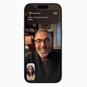 A phone screen shows a video call between a smiling older man with glasses and gray hair, and a younger woman. A message at the top reads, "Hello, it's great to see you." Live Translation helps them connect seamlessly.