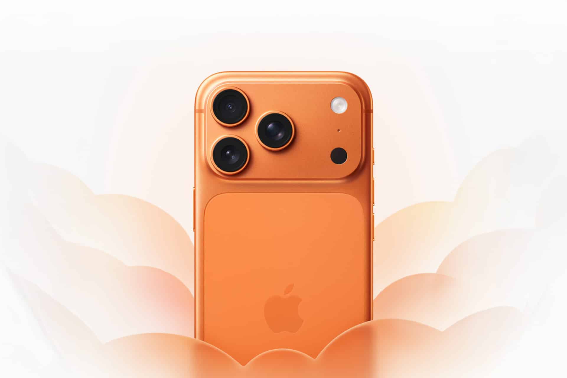 An orange smartphone with three rear cameras and an Apple logo is centered against a soft, white and orange abstract background resembling flower petals, capturing the festive spirit of Apple Lunar New Year.