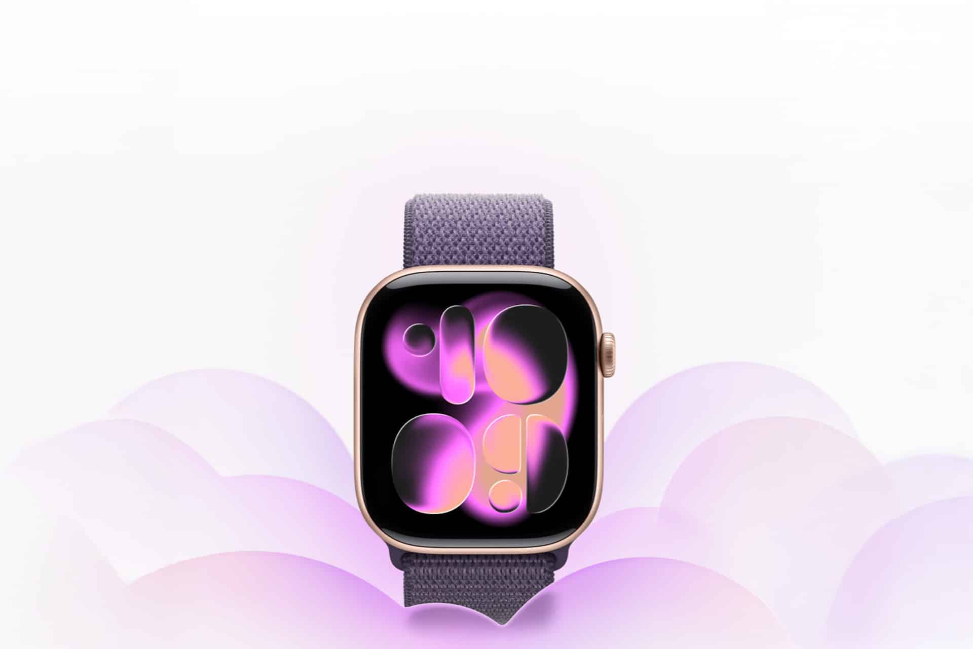 A smart watch with a purple and gold case and fabric band displays an abstract, glowing purple and pink design inspired by Apple Lunar New Year themes, set against a soft, pastel background with cloud-like shapes.