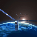 A group of small Apple Starlink satellites with solar panels orbits above Earth’s blue surface, as the sun rises in the background against the darkness of space.