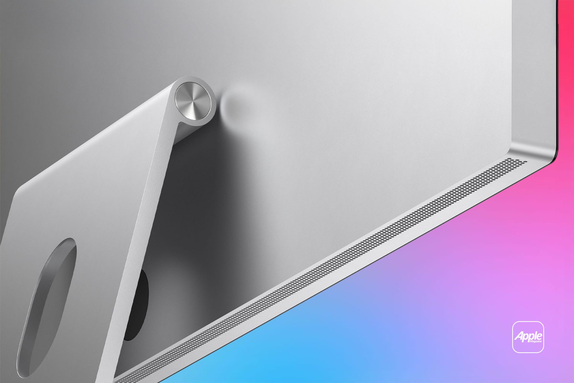 Close-up of the back of a silver Studio Display 2 monitor on a pink and blue gradient background, showing its stand and ventilation grille. An Apple logo is visible in the lower right corner.