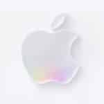 A minimalist, white Apple logo with a subtle rainbow-colored reflection at the bottom, set against a light gray background, celebrates WWDC 2026.