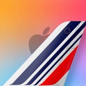 The tail fin of an Air France airplane with blue, white, and red stripes, a small circle of yellow stars, and a faint Apple logo in the background, set against a vibrant gradient background with an “Apple TV” icon in the lower right corner.