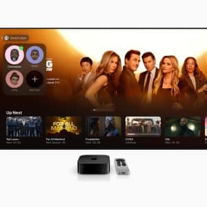 A TV screen displays the Apple TV interface with Apple TV Profiles on the left and a highlighted show on the right. TV shows like Ted Lasso and Foundation are featured. An Apple TV device and remote sit in front.