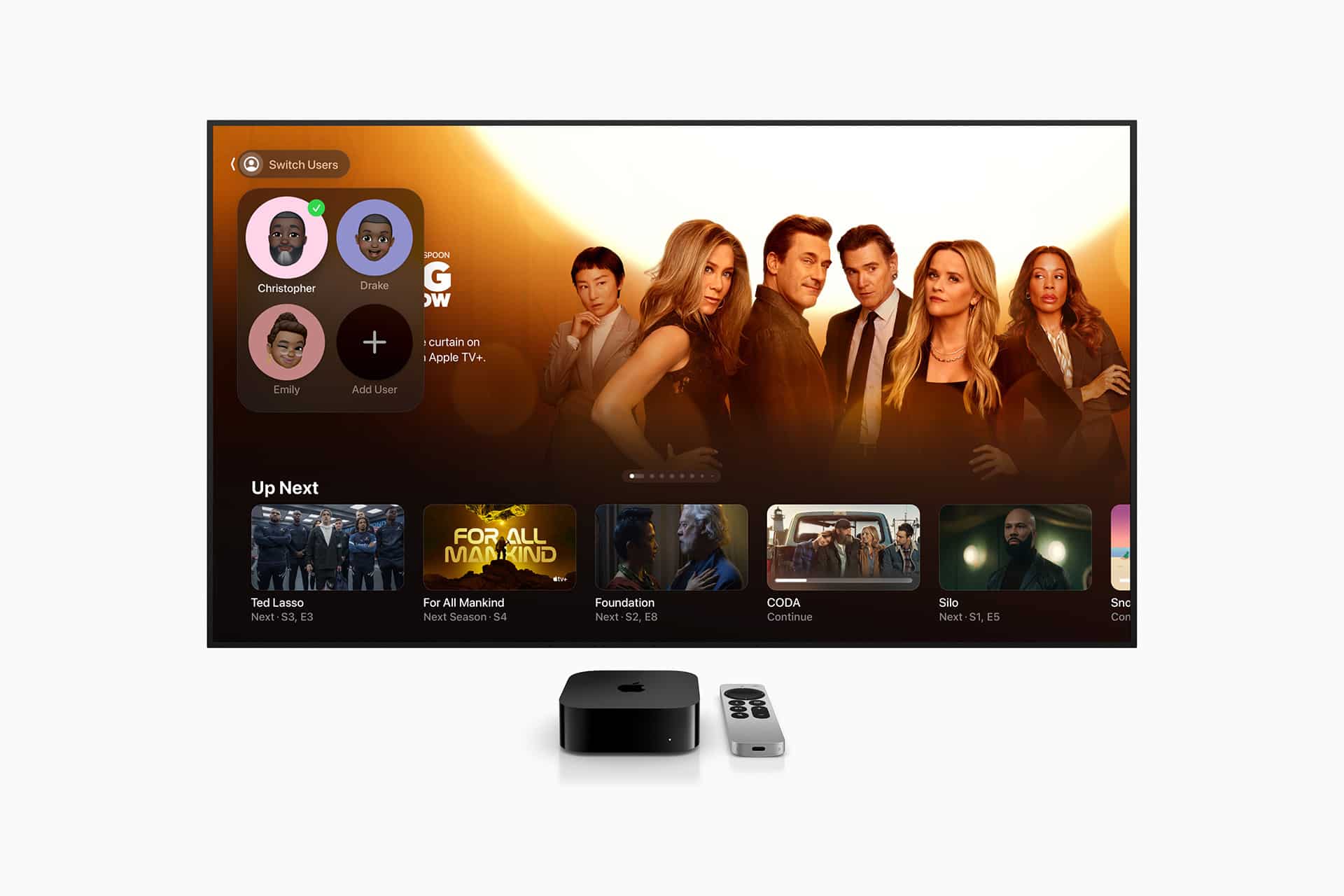A TV screen displays the Apple TV interface with Apple TV Profiles on the left and a highlighted show on the right. TV shows like Ted Lasso and Foundation are featured. An Apple TV device and remote sit in front.