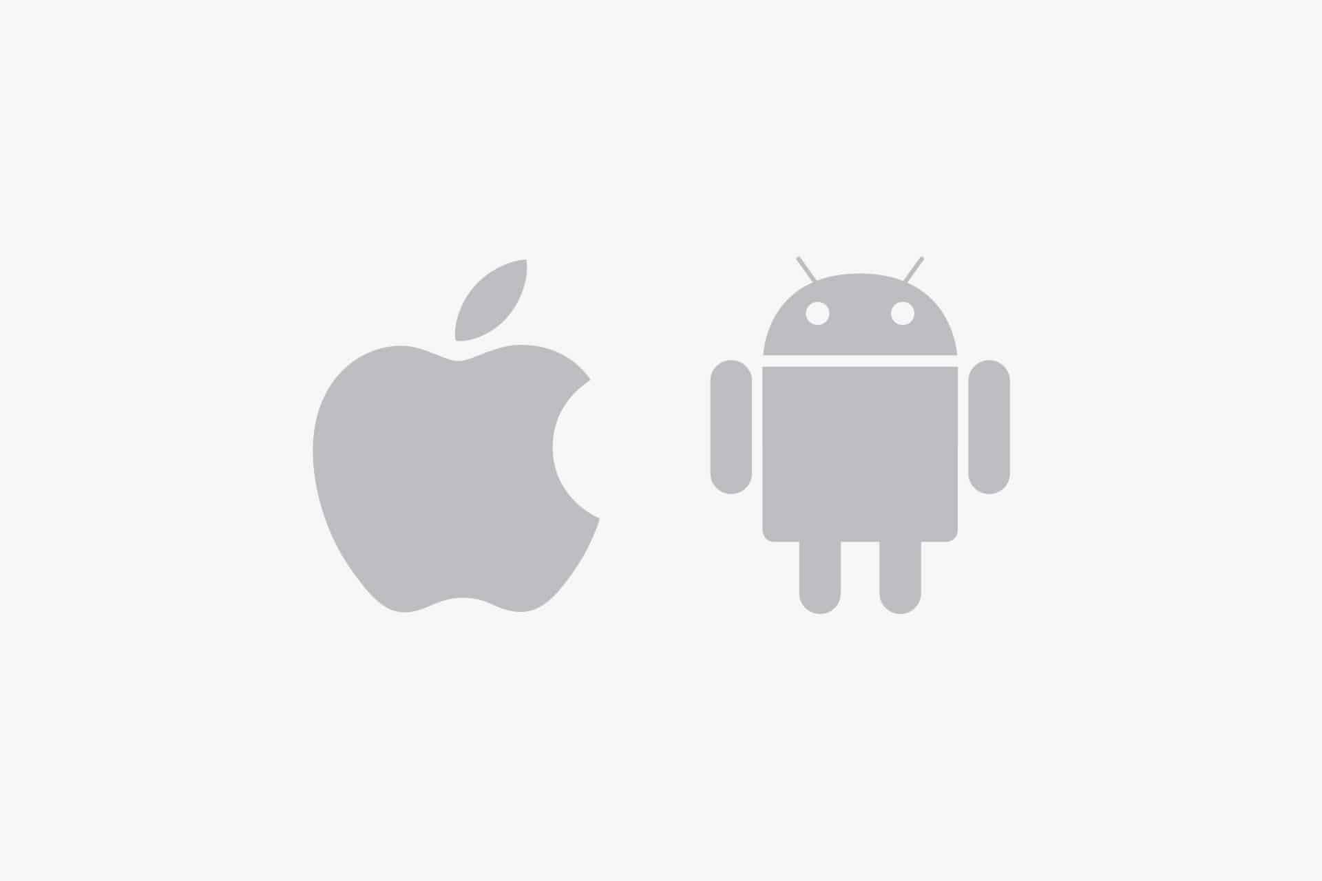 Gray Apple logo on the left and gray Android robot logo on the right, both centered on a plain white background, representing the iOS vs Android comparison.