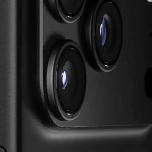 Close-up view of the iPhone 17 Pro Black’s triple-lens camera system, showing detailed lens surfaces and surrounding casing. The Apple logo appears in the lower right corner.