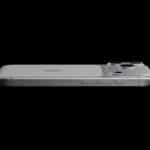 A silver iPhone with an aluminium frame is shown lying flat on its back against a black background, highlighting the side buttons and raised rear camera lenses.