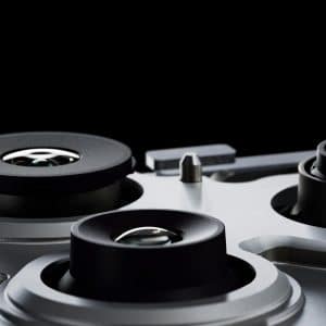 Close-up of three camera lenses on a silver smartphone, set against a black background. The image highlights the lens details and metallic finish of the iPhone 200Mp Camera module.