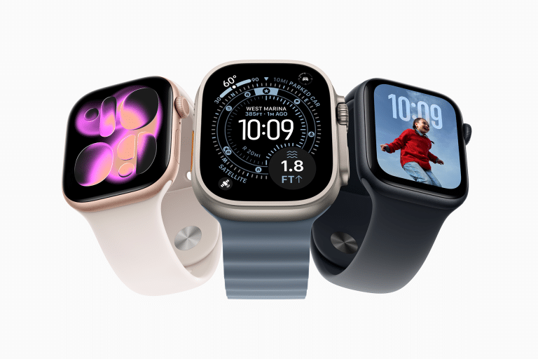 Three smartwatches with different colored bands are displayed. Each screen shows something unique: abstract shapes, detailed weather data, and a child jumping on a blue sky background, capturing the spirit of Apple Watch fitness motivation.