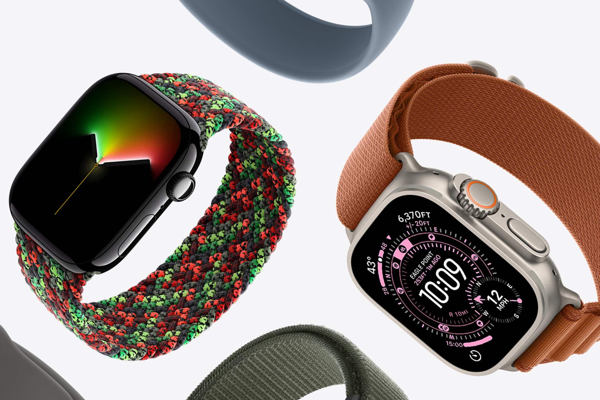 Two smartwatches with colorful loop bands are displayed on a white background; one features a black face with a minimal display and red-green band, while the other, perfect for pairing with an Apple Watch Band Skin Tone, shows a digital interface and an orange band.