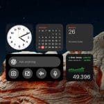 A digital dashboard with Mac Widgets displays a clock, January calendar, Monday the 26th, no events, a search bar, camera and microphone icons, Dow Jones info, and the number 49.396 over a rocky landscape at night.