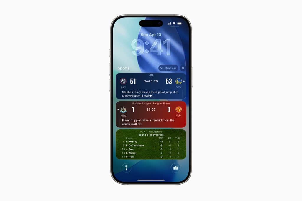 An iPhone displaying Apple Sports updates on the lock screen, including NBA scores, a soccer match between Manchester United and Manchester City, and a leaderboard for The Masters golf tournament.
