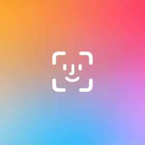 White Apple Face ID App Lock icon centered on a vibrant gradient background transitioning from yellow and orange (top left) to pink and red (top right), with blue and purple hues at the bottom. Small Apple logo at bottom right.